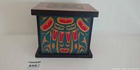 front view of painted wooden storage box