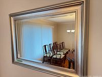 Full view of rectangular silver-framed wall mirror