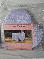 Front of packaged Juicy Couture collapsible storage cube showing heart-shaped lid and packaging details