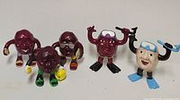 Group view of all five scuba-themed California Raisins figurines