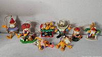 All seven Garfield ornaments in a row