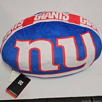 Full view of football pillow showing Giants logo