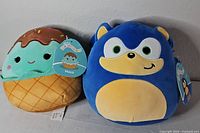 Front view of both Squishmallows showing characters and tags