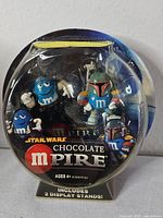 Front of sealed Chocolate Mpire package showing both figures