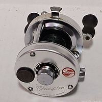 Front angled view showing Champion branding, High Speed badge, handle knobs