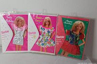 Three packaged Barbie Fashion Greeting Cards with outfits