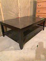 Full view of coffee table showing top and lower shelf