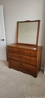 Full view dresser with attached mirror
