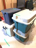 All four totes stacked together, showing colors and lids