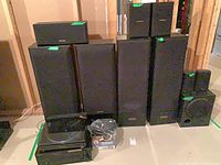 Full set showing receiver, turntable, ten speakers including towers, center, sub