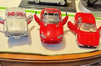 Front view of all three die-cast cars displayed side by side