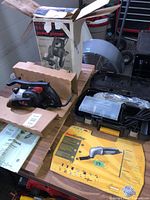 Overview of both tools, Craftsman planer with box, Rockwell SoniCrafter kit with case and accessories visible