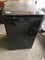 Front view of black Danby compact refrigerator