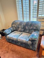 Front view of loveseat showing overall style and upholstery