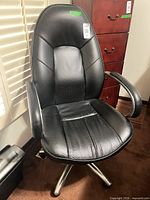 Full front view of black swivel office chair