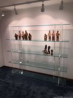 Full view of glass and acrylic shelving unit