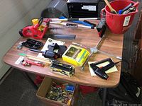 Tabletop view of primary tools and bucket