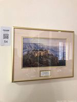 Full view of framed limited edition print on wall