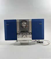 Front view of Fisher Slim-1500 stereo with blue speakers attached