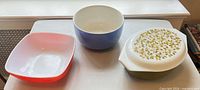 Three Pyrex pieces side-by-side on table
