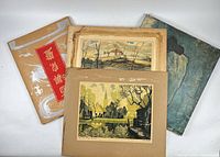 Stack of five mounted prints showing calligraphy panel, landscape, blue-toned figure artwork, others