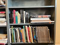 Full bookcase shelf showing majority of 61 photography titles