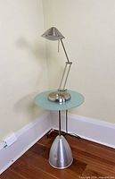 Side table with lamp placed on top, full view
