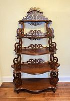 Full front view showing five tiers and crest