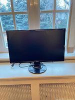 Front view of BenQ GL2460 monitor on stand