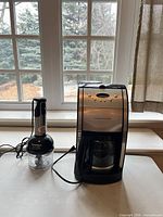 Coffee maker and mini processor side by side on tabletop