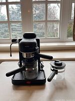 Front view of Krups 968 espresso machine with carafe and separate carafe lid