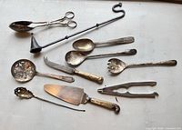 Overview of all ten utensils displayed on surface