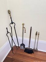 All six fireplace tools standing in corner