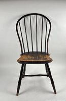 Full front view showing bow-back, seat, legs