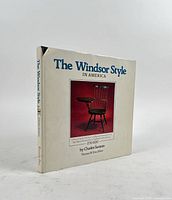 Front angled view of hardcover book with dust jacket