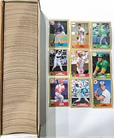 Full row of cards inside long factory box