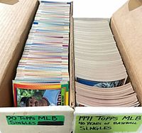 Two columns of cards in box labelled 90 Topps MLB Singles and 1991 Topps MLB 40 Years Baseball Singles