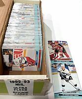 Long cardboard box filled with sleeved hockey cards with label showing 1992-93 NHL Ultra Fleer Rookie Cards