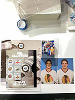 Group view showing stamp sheet, Brett Hull photo card, two Blackhawks headshots, portion of card storage box