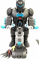 Full view of mech with figures and accessories