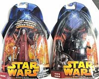 Front view of both sealed figures in blister packaging