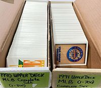 Two-row cardboard box with 1990 and 1991 Upper Deck sets labeled