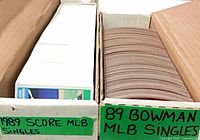 Two rows of loose cards in cardboard box labeled 1989 Score MLB Singles and 89 Bowman MLB Singles