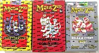 Front view of three sealed MetaZoo boxes: yellow Release Event, red Hopkinsville Goblin King, silver UFO Release Event