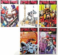 Group shot of all five Optimus Prime comics showing cover art