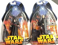 Both sealed Palpatine figures side by side in original packaging