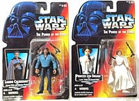 Front view of both sealed Lando and Leia Power of the Force figures on cardbacks