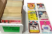 Single-row card box filled with stacked vintage hockey cards and six sample cards laid out