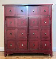 Front view showing all faux drawer panels and metal knobs