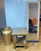 End table, mirror and milk can grouped